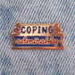 Coping admirably enamel pin